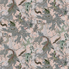Patterned fabric with green leaves and branches on a light pink background